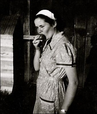 1937: Mom Eating a Tomato. Photo.